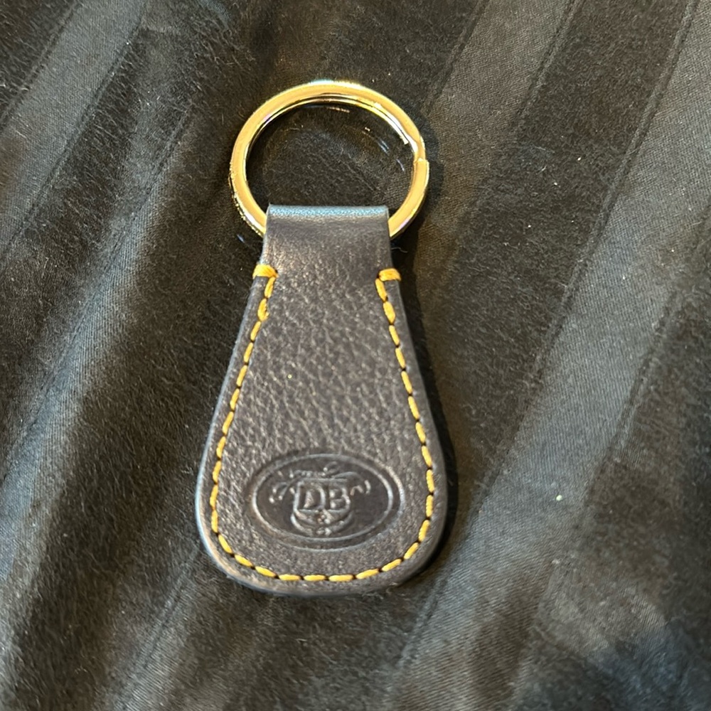 Navy blue Dooney & Bourke key chain. Excellent condition - new without t…